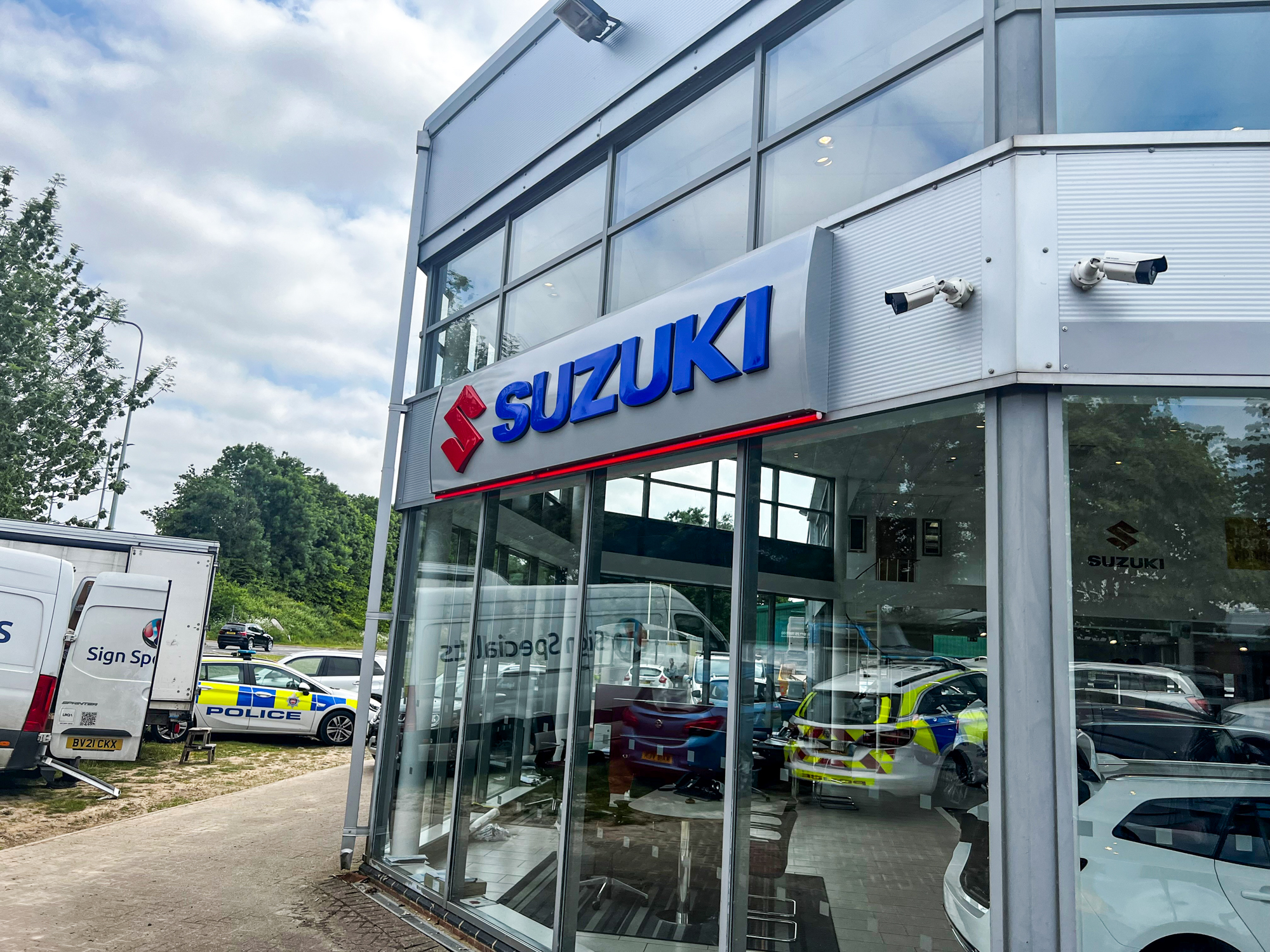 EMC Uckfield one side of the building with Suzuki Sign