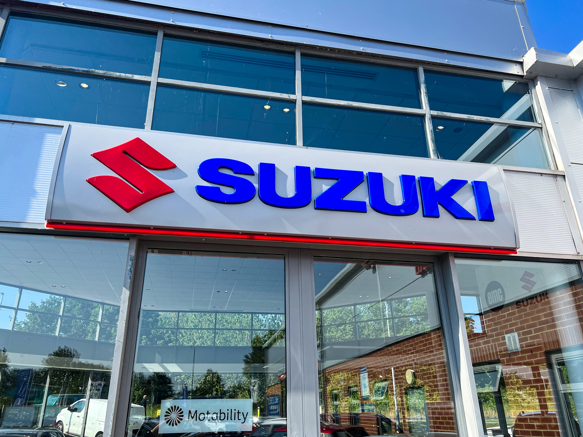 Suzuki sign over door