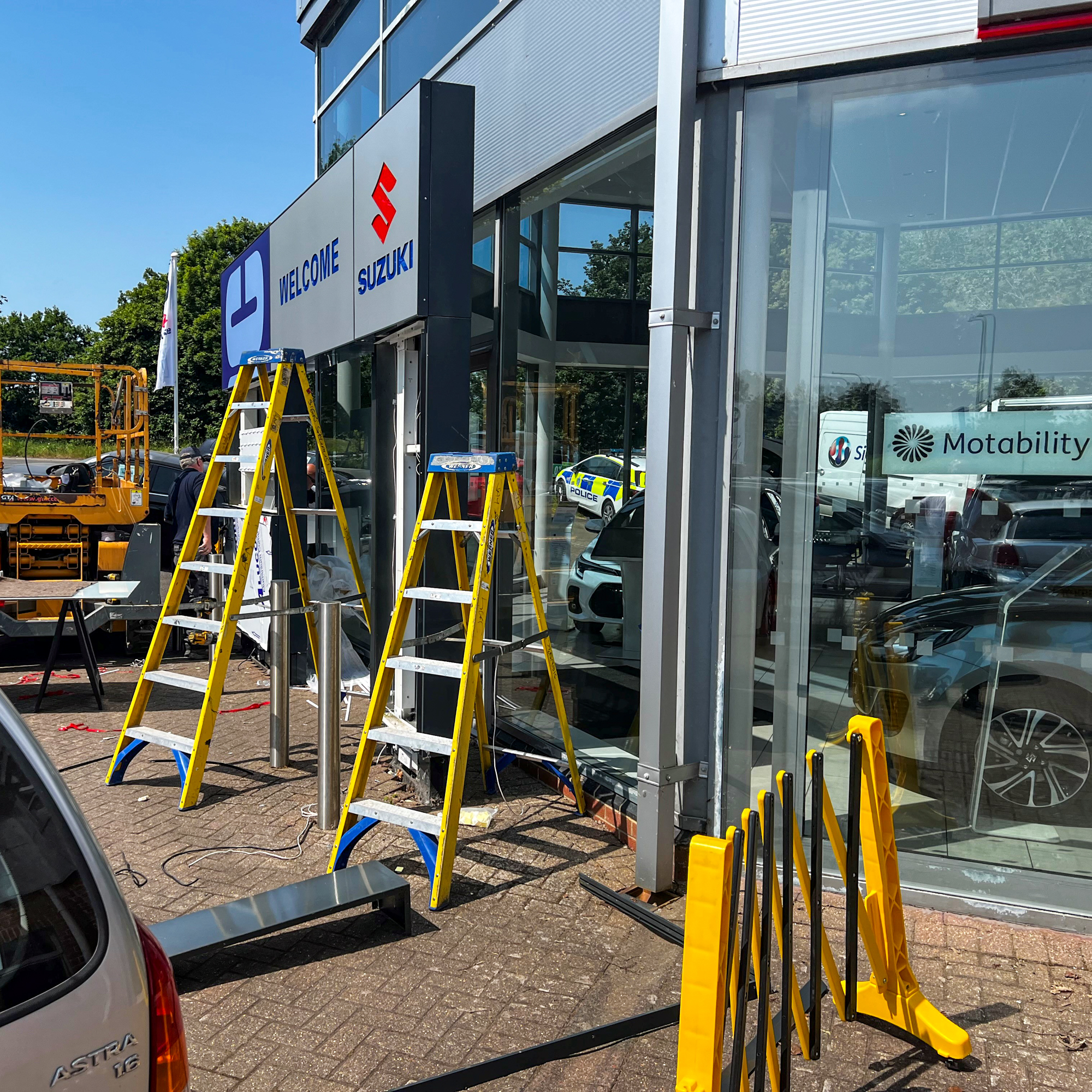 Ladders in front of EMC Uckfield Suzuki