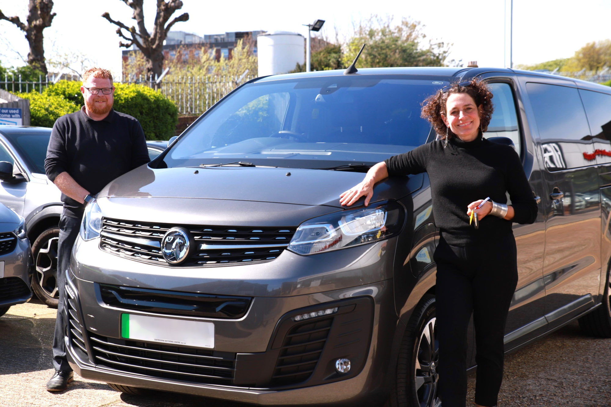 Alex Polizzi standing with her new Vauxhall Vivaro-e Life and Phil Mulvey