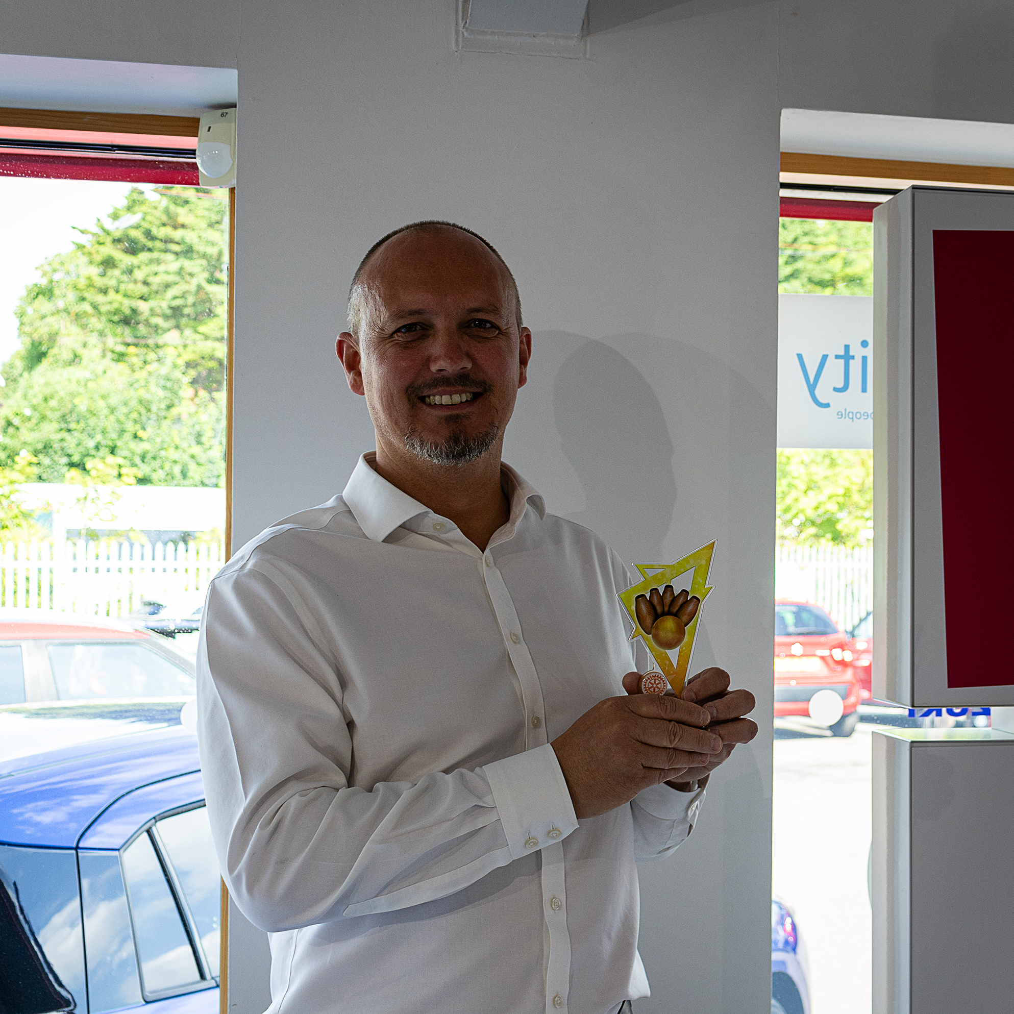 Suzuki Sales Manager Dan Neill with the 2024 Skittles Trophy